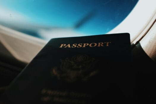 Close-up of a passport inside an airplane, symbolizing international fans traveling to Morocco with the Electronic Travel Pass for AFCON 2025.