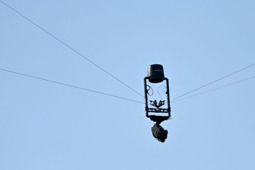 Close-up of a Spidercam suspended above a football stadium during a match, symbolizing Morocco’s AFCON 2025 broadcast technology upgrades.