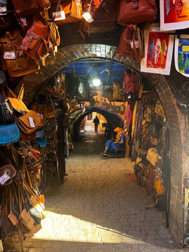 Souk Cherratine leather market alley in Marrakech Medina with handmade Moroccan bags and crafts