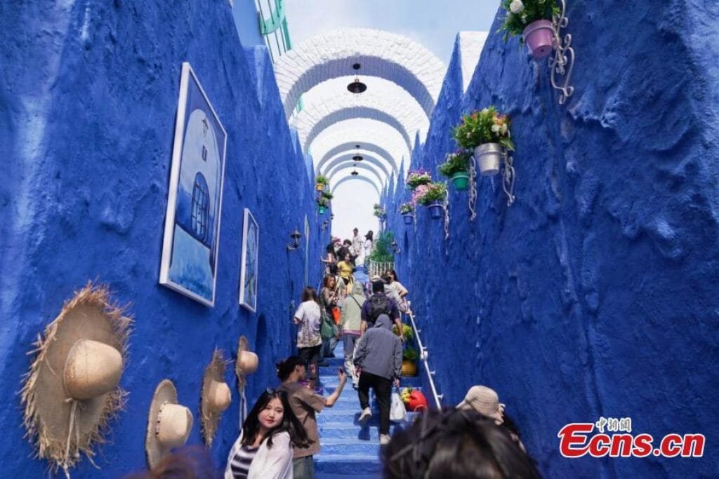 Tourists visit a replica of Morocco’s “blue city” Chefchaouen at Harbin Polarland in Harbin, northeast China’s Heilongjiang Province,
Photo Credit: China News Service/Zhao Yuhang / Chinanews.com