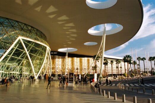 Modern view of Marrakech-Menara Airport’s glass terminal welcoming 734 international flights in one week, November 2025