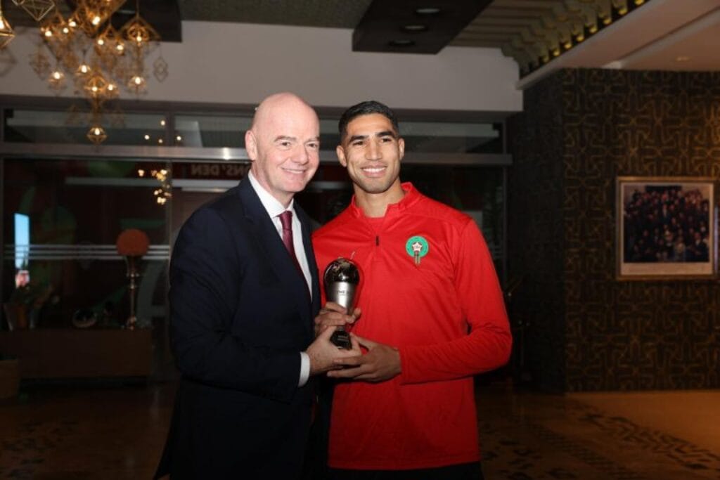 Gianni Infantino awards FIFA The Best Starting 11 trophy to Achraf Hakimi in Morocco