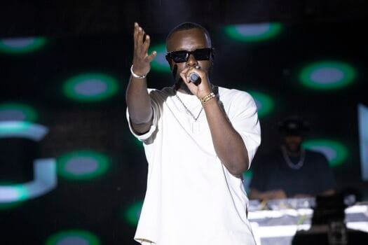 Gims performing on stage, the artist who attended the DR Congo vs Botswana match during CAN 2025 in Morocco