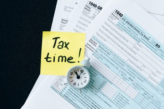Documents and clock illustrating VAT refund and tax-free shopping rules for tourists in Morocco