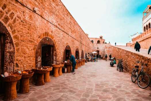 Artisans selling traditional goods inside the stone ramparts of Essaouira’s medina
