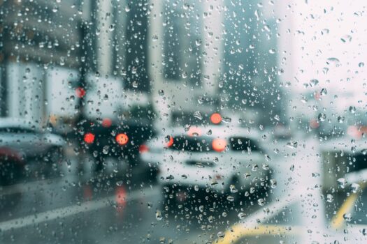 Rainfall on a city street in Morocco during an unusually wet winter season affecting AFCON 2025 host cities.
