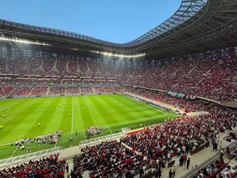 A packed football stadium in Rabat filled with supporters during a major international match