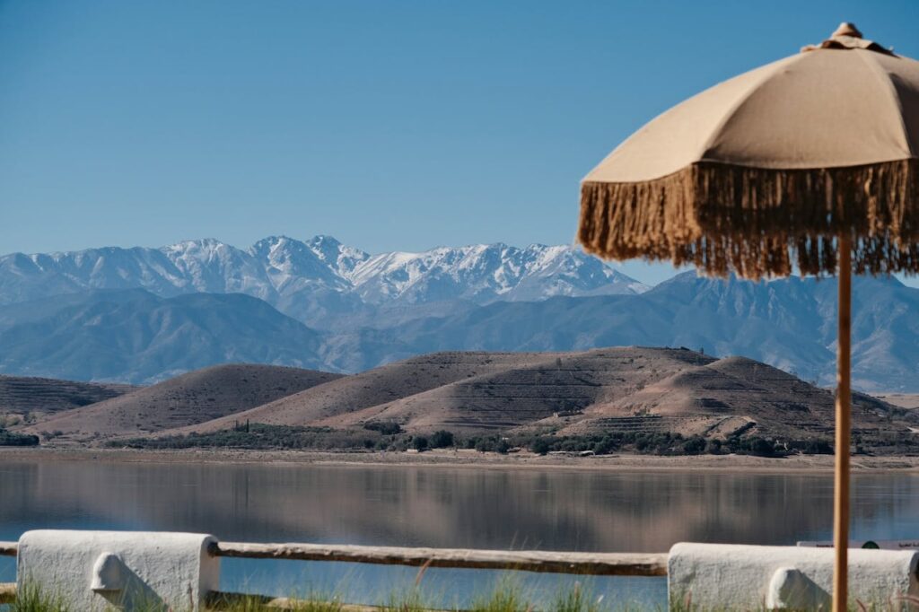 View of Lalla Takerkoust Lake with the snow-covered Atlas Mountains in the background near Marrakech