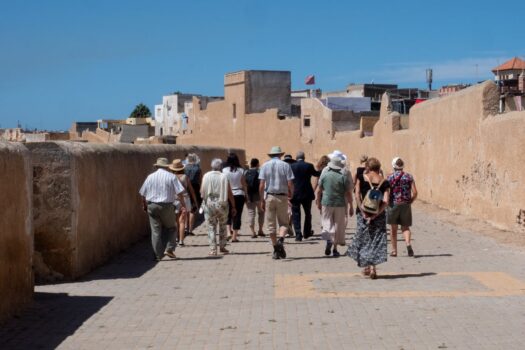Visitors walking along the historic ramparts of the Portuguese City of El Jadida UNESCO site in Morocco