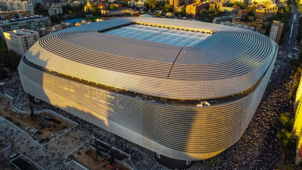 Aerial view of Santiago Bernabéu Stadium in Madrid, Spain, compared with Grand Stade Hassan II as a contender for the 2030 World Cup final